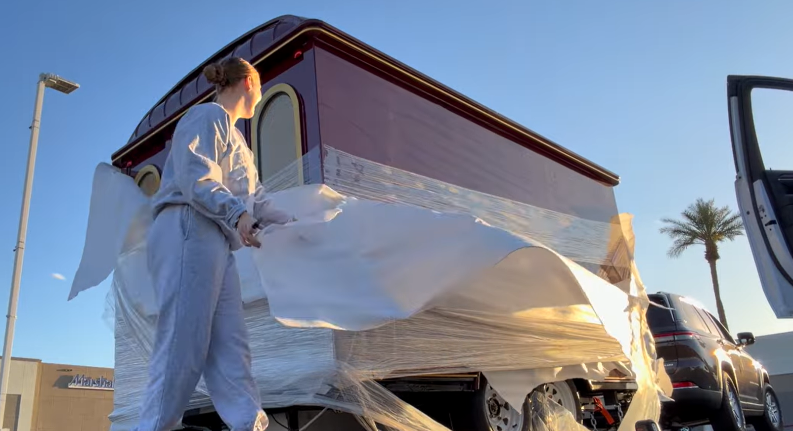 Customer unpacking a delivered custom food trailer