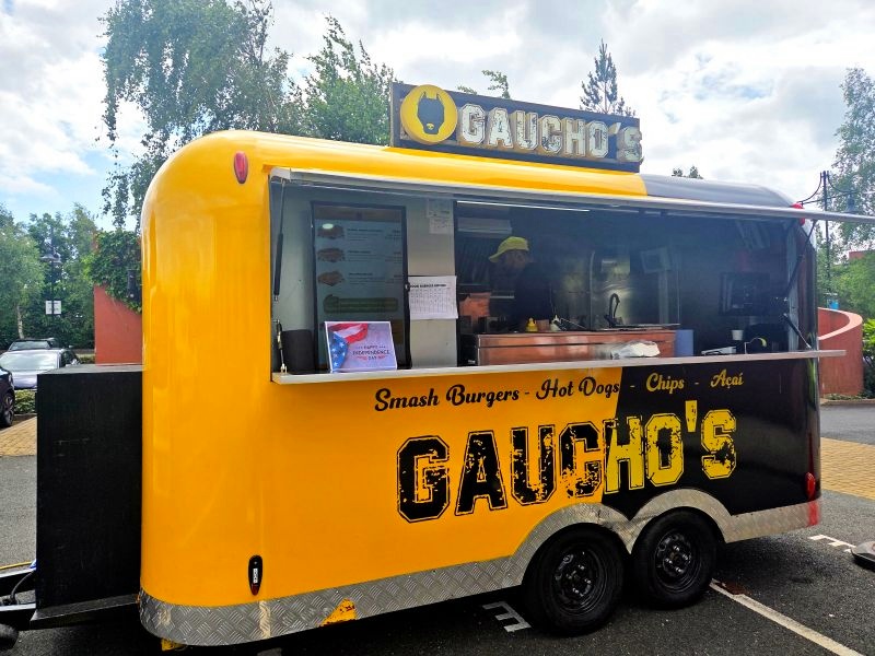 Customer food trailer open and serving customers